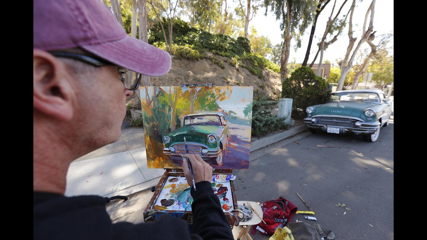 Joe Gyurcsak of New Jersey paints a 1955 Buick in Laguna Beach on Tuesday. Gyurcsak is a participant in the Laguna Beach Plein Air Painting Invitational.