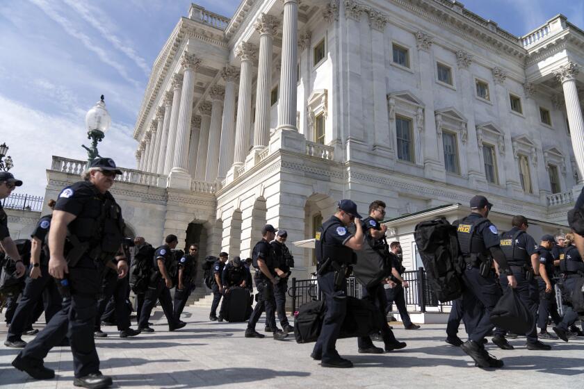 U.S Capitol police officers walk into the Capitol building a day before of Israel's Prime Minister Benjamin Netanyahu visit to Capitol Hill, Tuesday, July 23, 2024, in Washington. ( AP Photo/Jose Luis Magana)