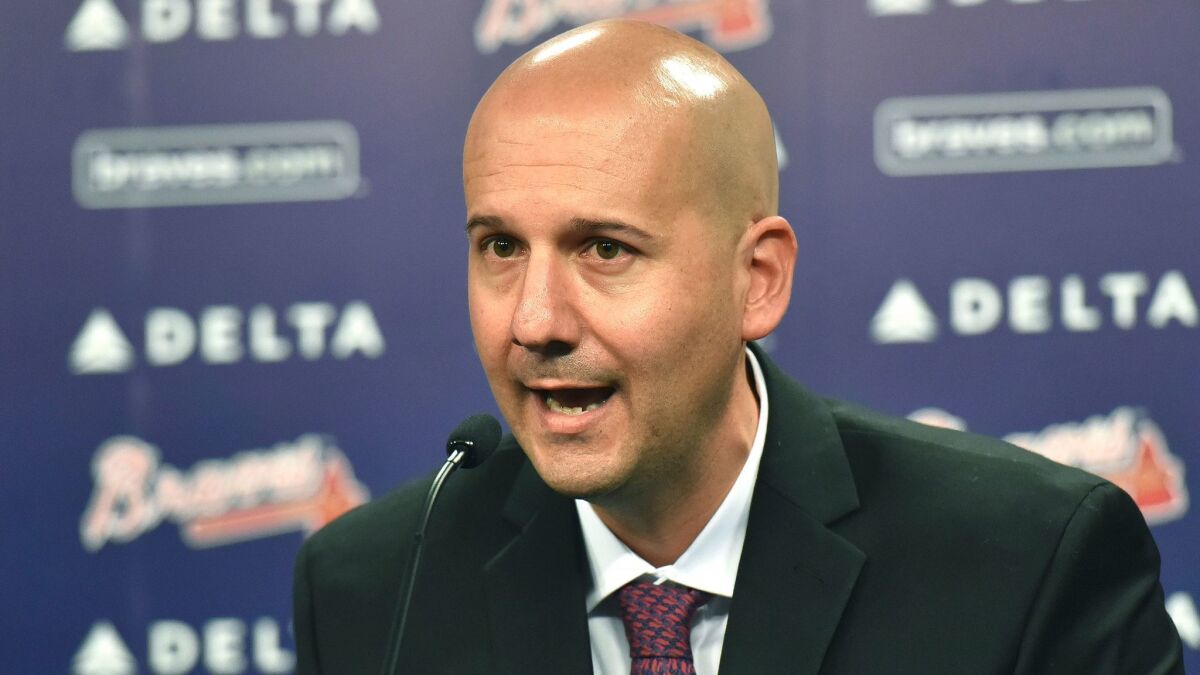 Former Atlanta Braves general manager John Coppolella, shown in 2015, was banned from baseball for life on Tuesday.
