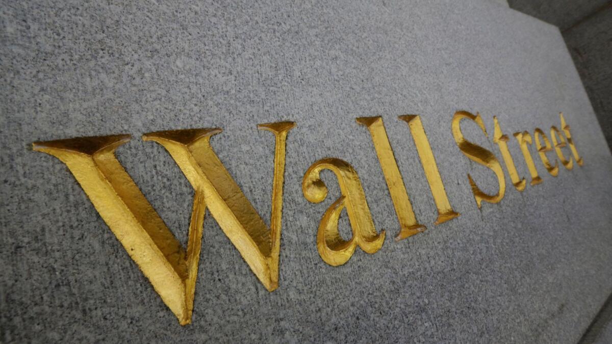 "Wall Street" is etched in the facade of a building in New York's financial district.