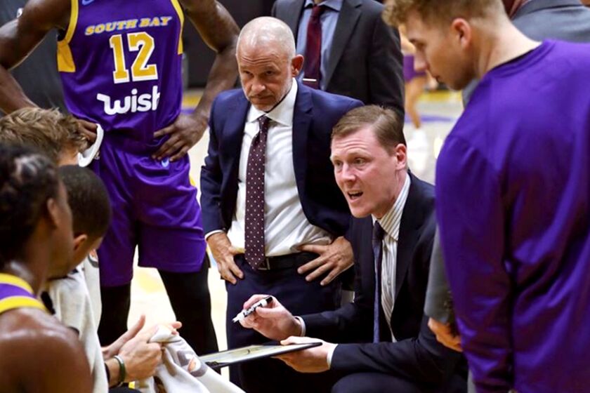 South Bay Lakers coach Coby Karl draw up a play during a recent G League game.