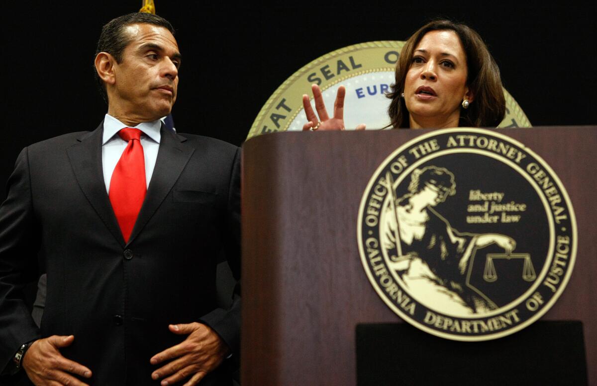 Antonio Villaraigosa, then Los Angeles mayor, listens to state Atty. Gen. Kamala D. Harris at a 2011 news conference on mortgage fraud in Los Angeles.