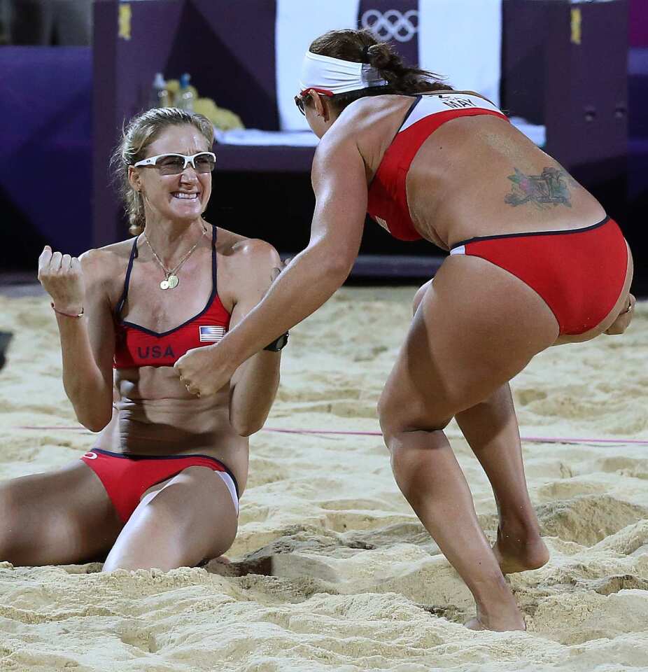 U.S. teammates Misty May-Treanor, right, and Kerri Walsh Jennings celebrate seconds after winning the gold medal in women's beach volleyball. They also won gold in Beijing and Athens.