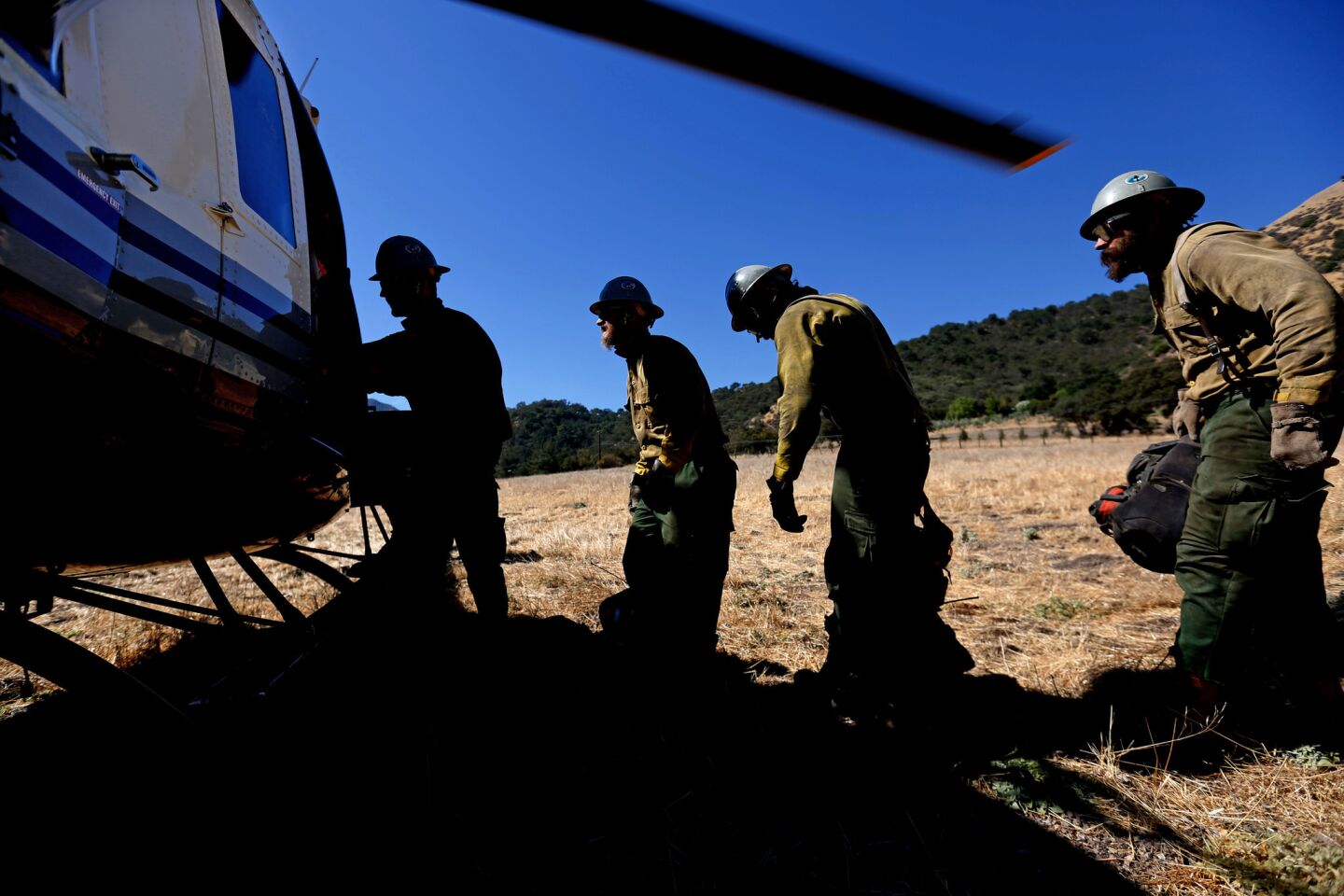 The U.S. Forest Service Smith River Hotshot Crew is air-lifted by helicopter to battle the Soberanes fire burning in Garrapata State Park in the Los Padres National Forest.