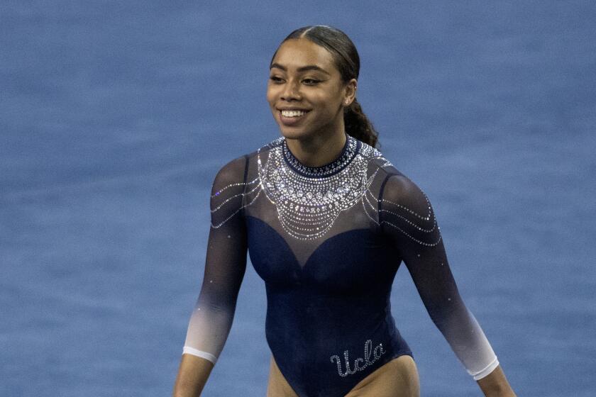 UCLA's Margzetta Frazier competes on the floor during a meet against Arizona State on Jan. 23, 2021, in Los Angeles.