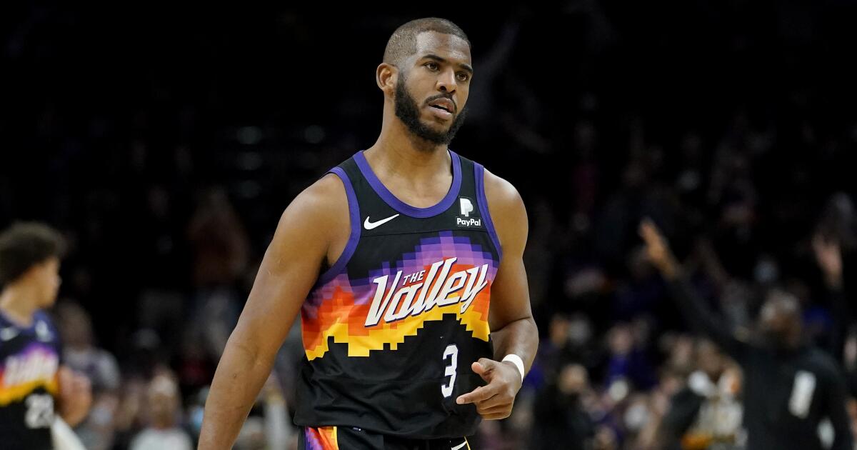Chris Paul looks to push the ball in a Clipper blue jersey