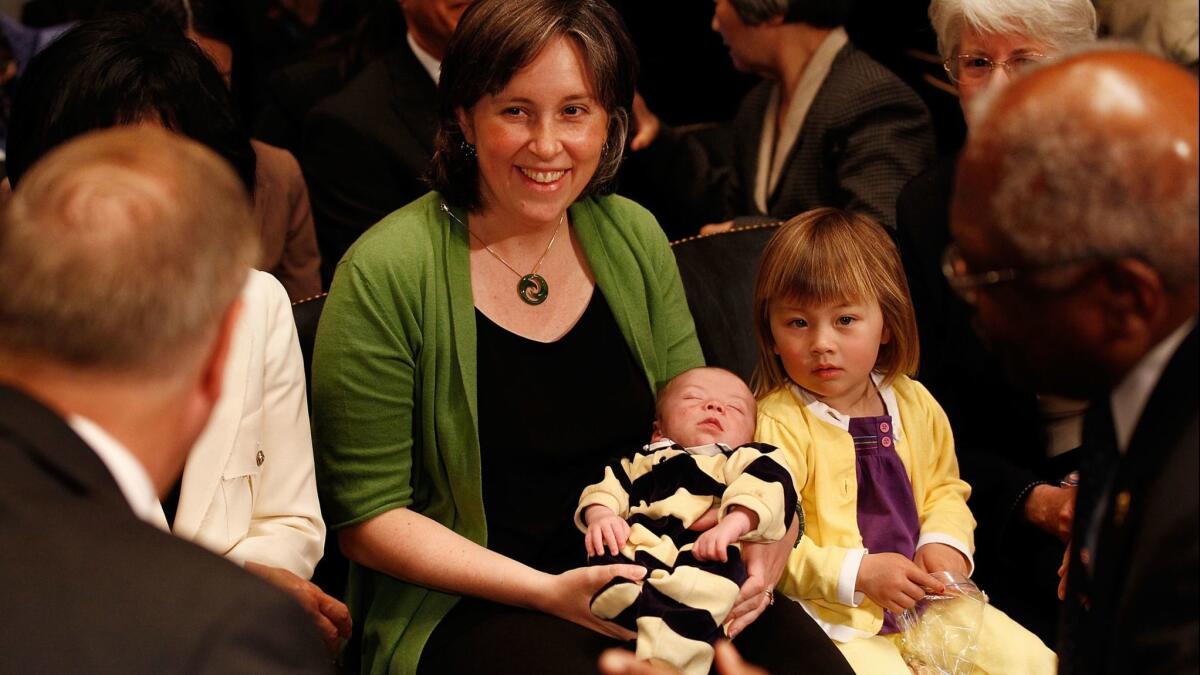 Ann O'Leary, seen here in 2010 holding her newborn baby at an event in Washington, was chosen by Gov.-elect Gavin Newsom to serve as his chief of staff.