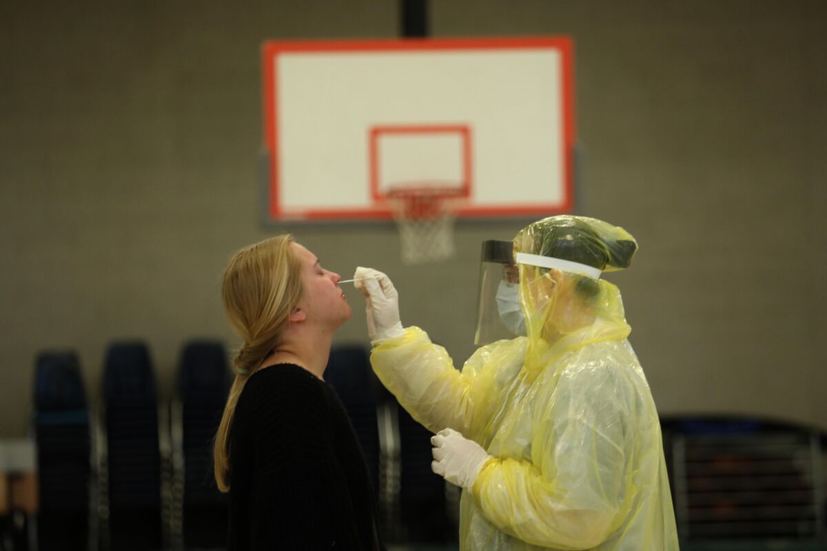 Hailey Boland is swabbed for the virus at a Mariposa school gym.