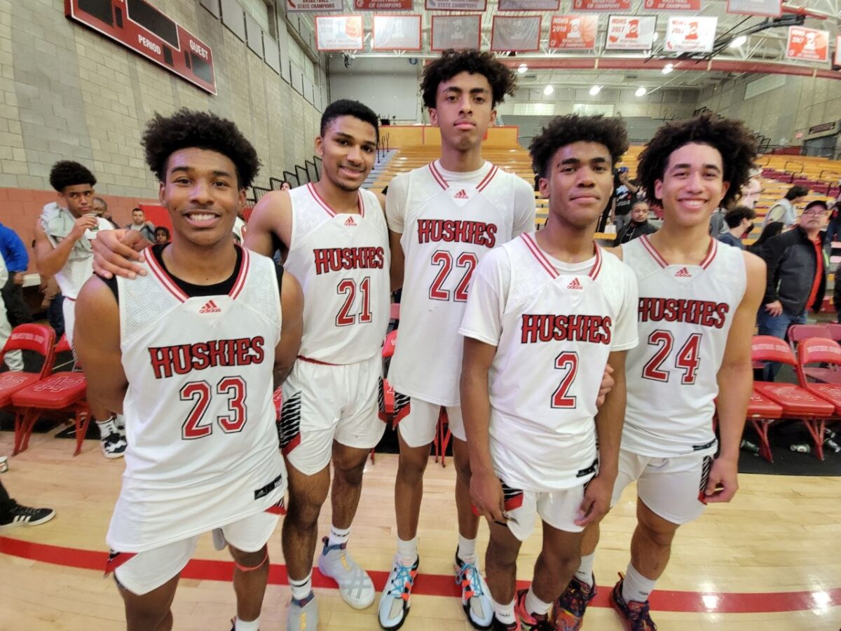 Corona Centennial players stand together.