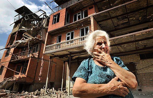 A Georgian woman cries in front of her destroyed apartment building in the city of Gori, Georgia. Georgia reported Russian tanks moving into its key central city of Gori outside the breakaway province of South Ossetia.