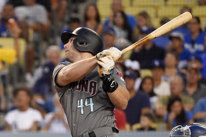 FILE - In this Aug. 31, 2018 file photo Arizona Diamondbacks' Paul Goldschmidt hits a two-run home run during the first inning of a baseball game against the Los Angeles Dodgers in Los Angeles. The St. Louis Cardinals have acquired Goldschmidt from the Diamondbacks in a multiplayer trade. The Cardinals sent pitcher Luke Weaver, catcher Carson Kelly, minor league infielder Andy Young and a 2019 draft pick to Arizona in the deal Wednesday, Dec. 5, 2018. (AP Photo/Mark J. Terrill)