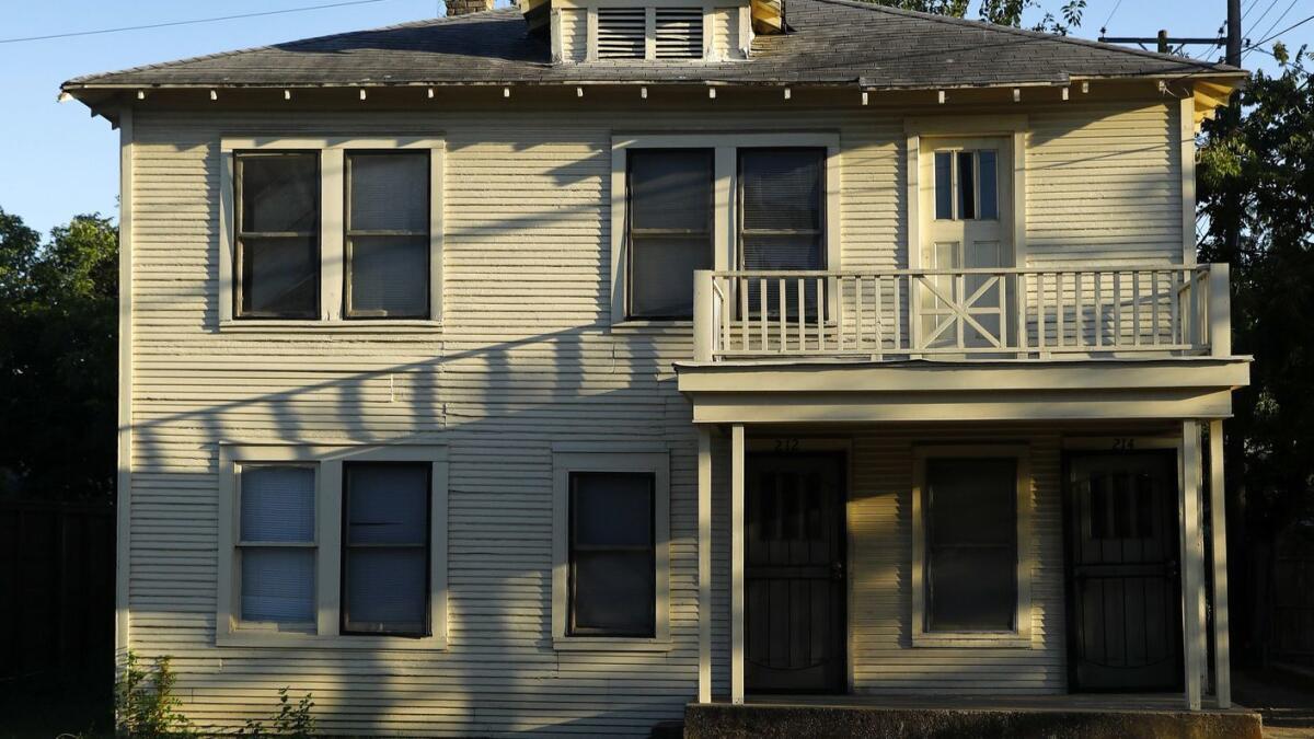 This August photo shows the exterior of a home at 214 West Neely St. in Dallas where Lee Harvey Oswald lived in 1963.