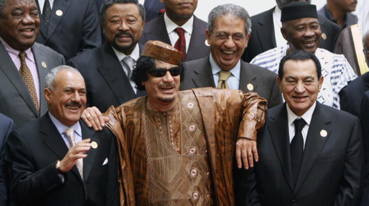  Libyan leader Moammar Kadafi is flanked by Arab world counterparts Ali Abdullah Saleh, left, of Yemen and Egypt's Hosni Mubarak.