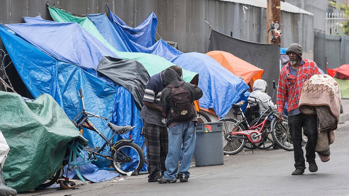Homeless people at an encampment on L.A.'s skid row.