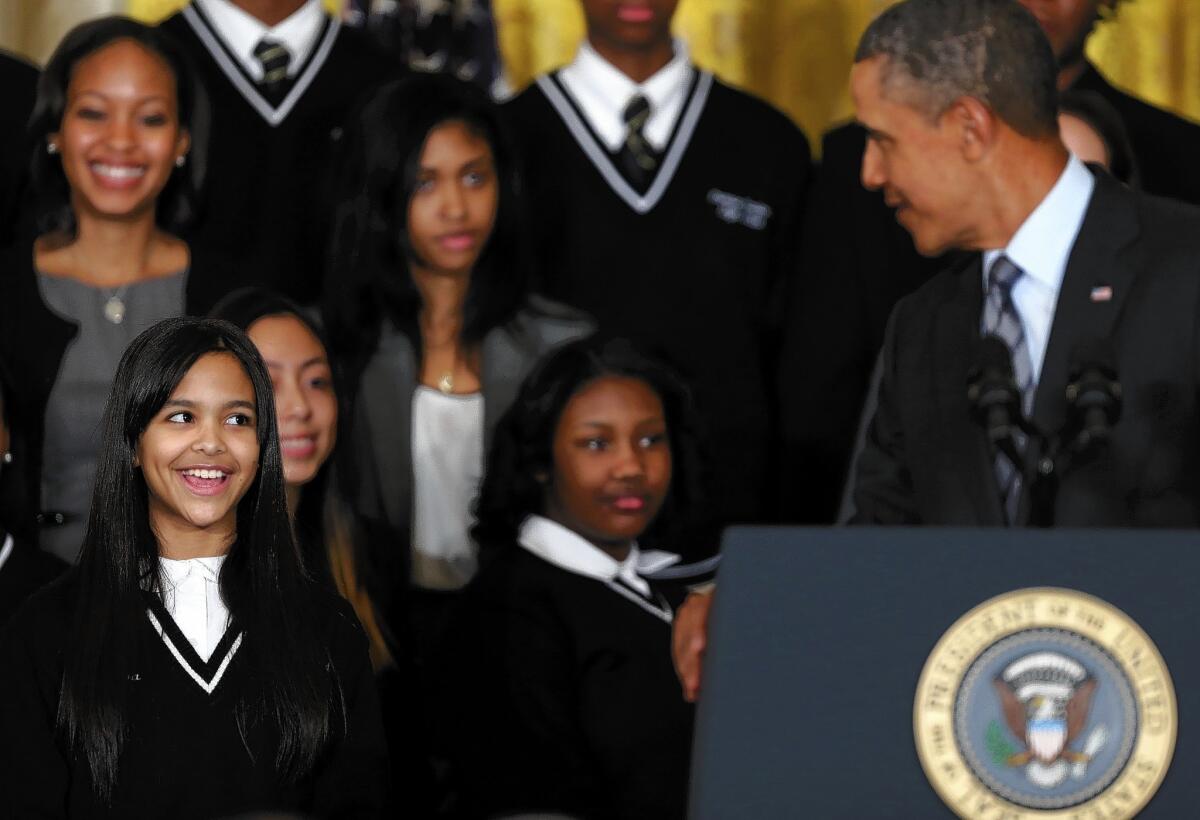 President Obama with students at a New York City school on Thursday as he identifies 'Promise Zones' in five cities that will be eligible for federal anti-poverty grants.