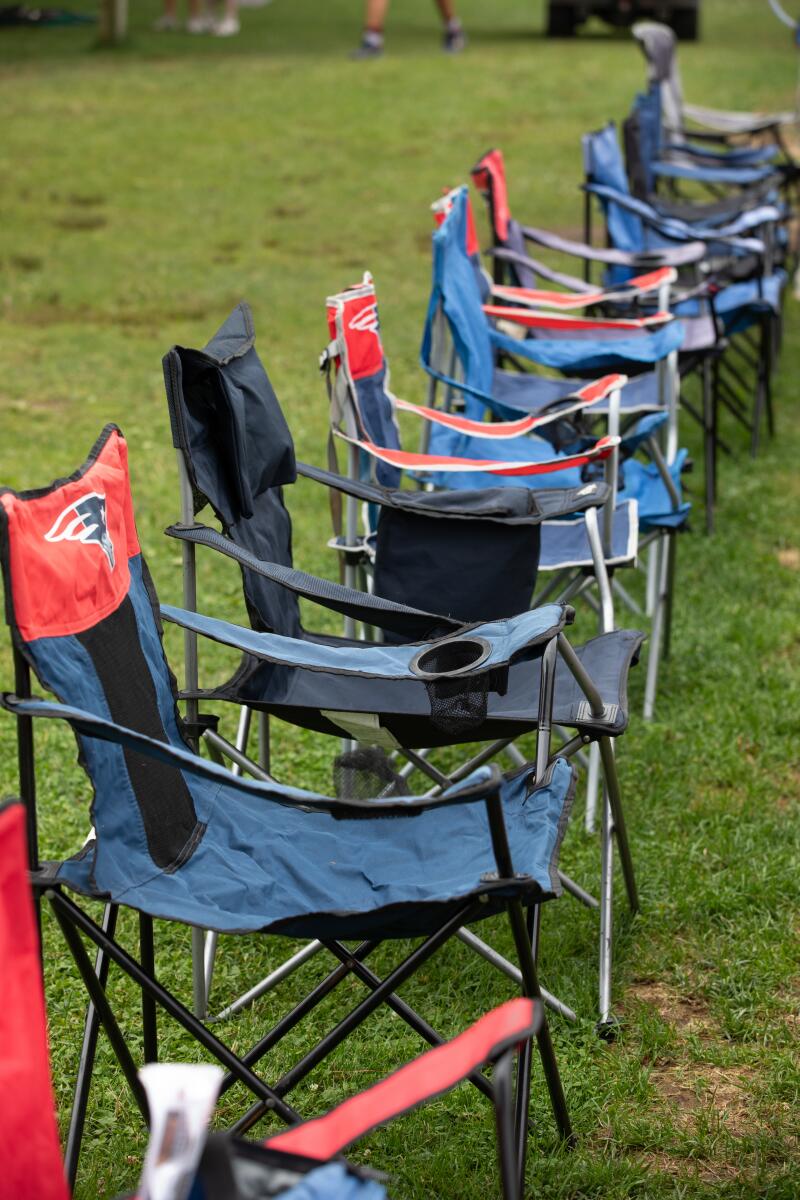 Seats are placed hours before game-time in preparation for a Yarmouth-Dennis Red Sox game.