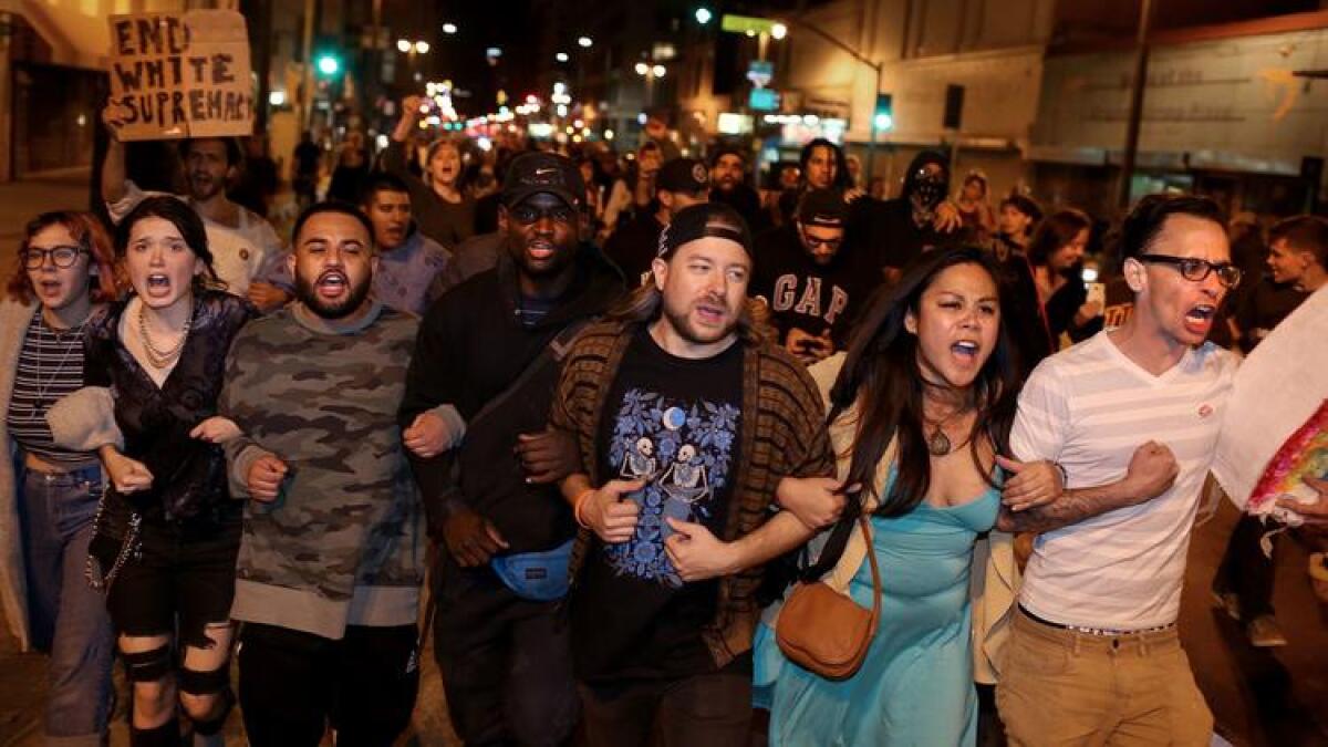 People protesting the election of Donald Trump take to the streets of downtown Los Angeles on Wednesday morning.