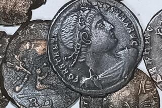 A picture made available by the Italian Culture Minister showing some of the discovered ancient bronze coins. A diver's spotting something metallic not far from the Sardinian coast has led to the discovery of tens of thousands of ancient bronze coins. Italy's culture ministry said on Saturday, Nov. 4, 2023, that the diver alerted authorities, who sent divers assigned to an art protection squad along with others from the ministry's undersea archaeology department. Found in sea grass, not far from the northeast shore of the Mediterranean island were the coins dating from the first half of the 4th century. (Italian Culture Ministry Via AP)
