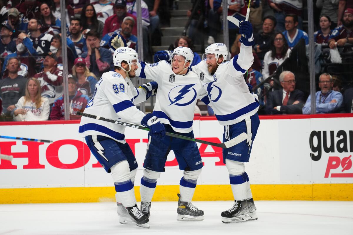 Tampa Bay's Ondrej Palat, middle, celebrates his goal with teammates Mikhail Sergachev, left, and Steven Stamkos.