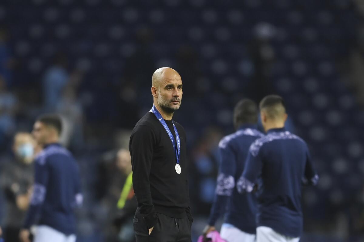 Manchester City coach Pep Guardiola reacts after losing the Champions League final 