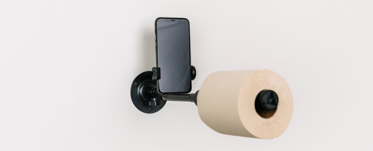 A toilet paper holder design by WeShouldDoItAll includes a cellphone holder.