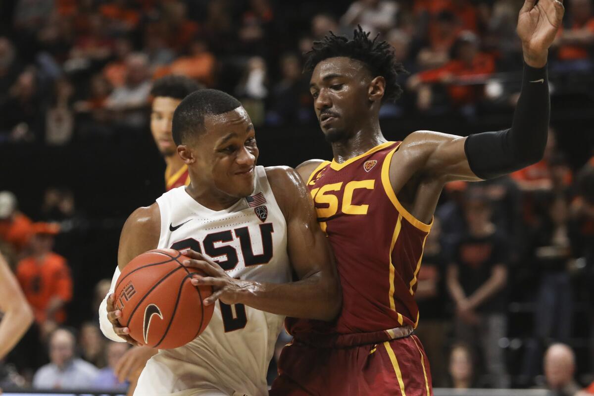Oregon State's Gianni Hunt tries to get past USC's Jonah Mathews during the second half of the Trojans' 75-55 win on Jan. 25, 2020.