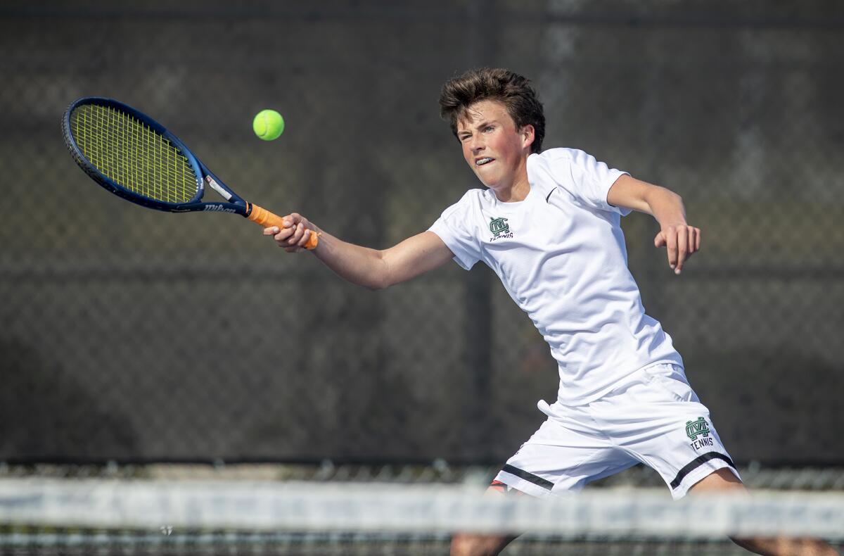 Costa Mesa's Ryan Taylor returns a forehand during a Battle for the Bell match at Costa Mesa High School on Tuesday.