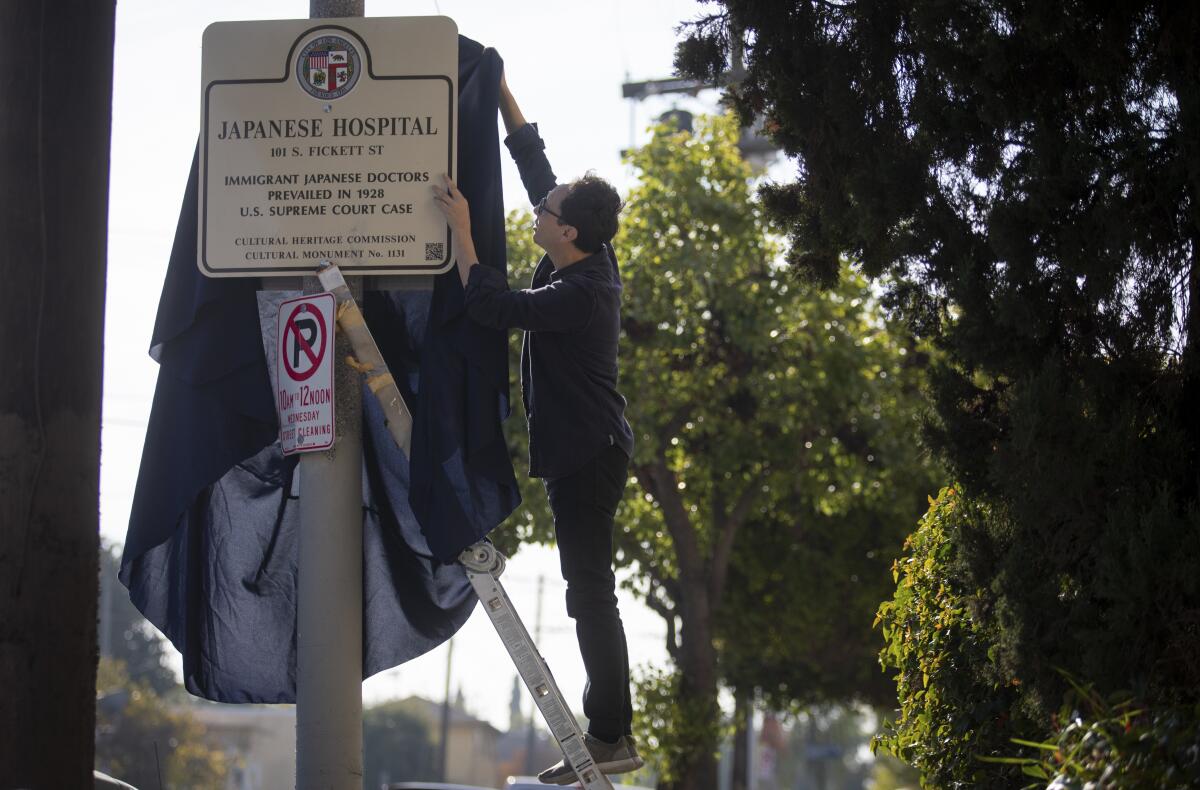 Preparing to unveil a historical monument sign