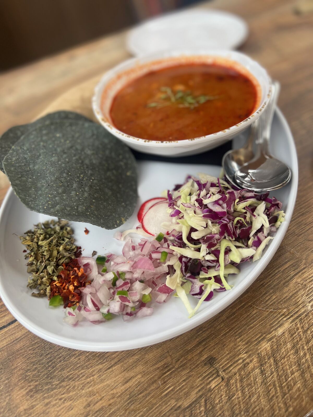 Pollo Pozole Rojo is one of the build-your-own dishes on the menu at newly opened La Cocina Mesa in Carlsbad.
