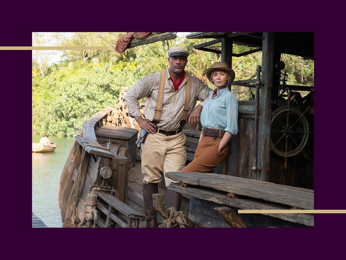 Dwayne Johnson and Emily Blunt pose on a boat.