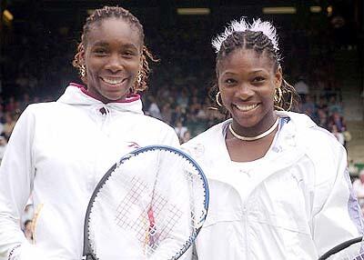 Venus and Serena Williams pose together at Wimbledon