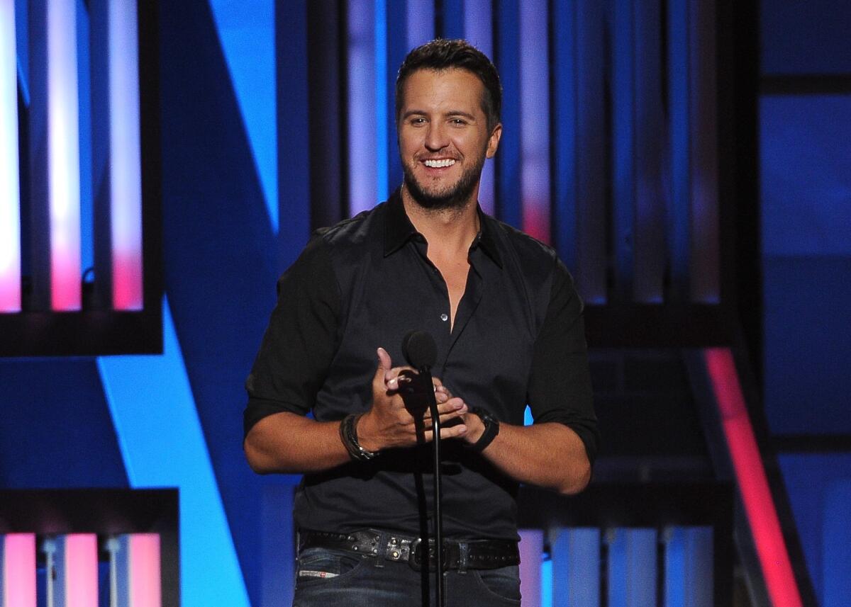 Country star Luke Bryan, shown performing in Las Vegas in April, fell off the stage during a concert in Charlotte, N.C. on Thursday night.
