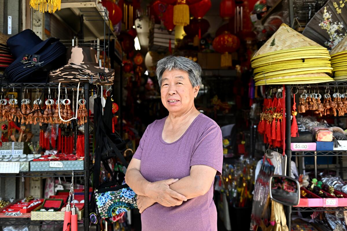 A woman stands in a gift shop