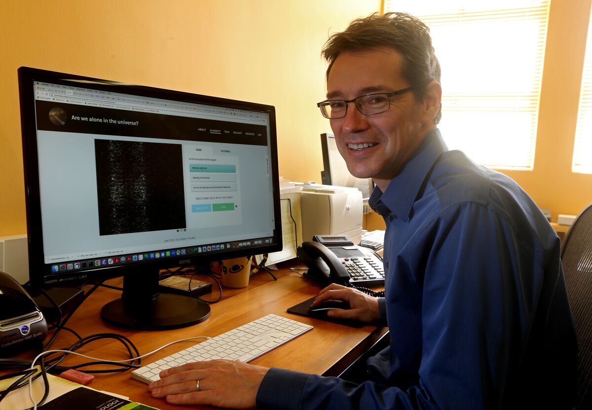 Jean-Luc Margot uses the "Are we alone in the universe?" website in his office at UCLA.