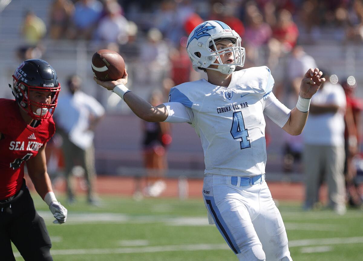 Corona del Mar's Ethan Garbers pulls up to throw a touchdown at Palos Verdes in a nonleague game on Friday.