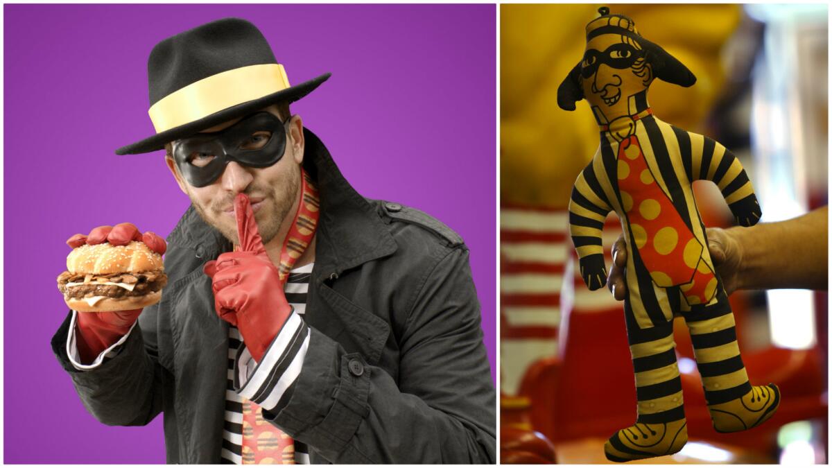 The 2015 version of McDonald's Hamburglar, left, and a stuffed doll depicting the 1970s version.