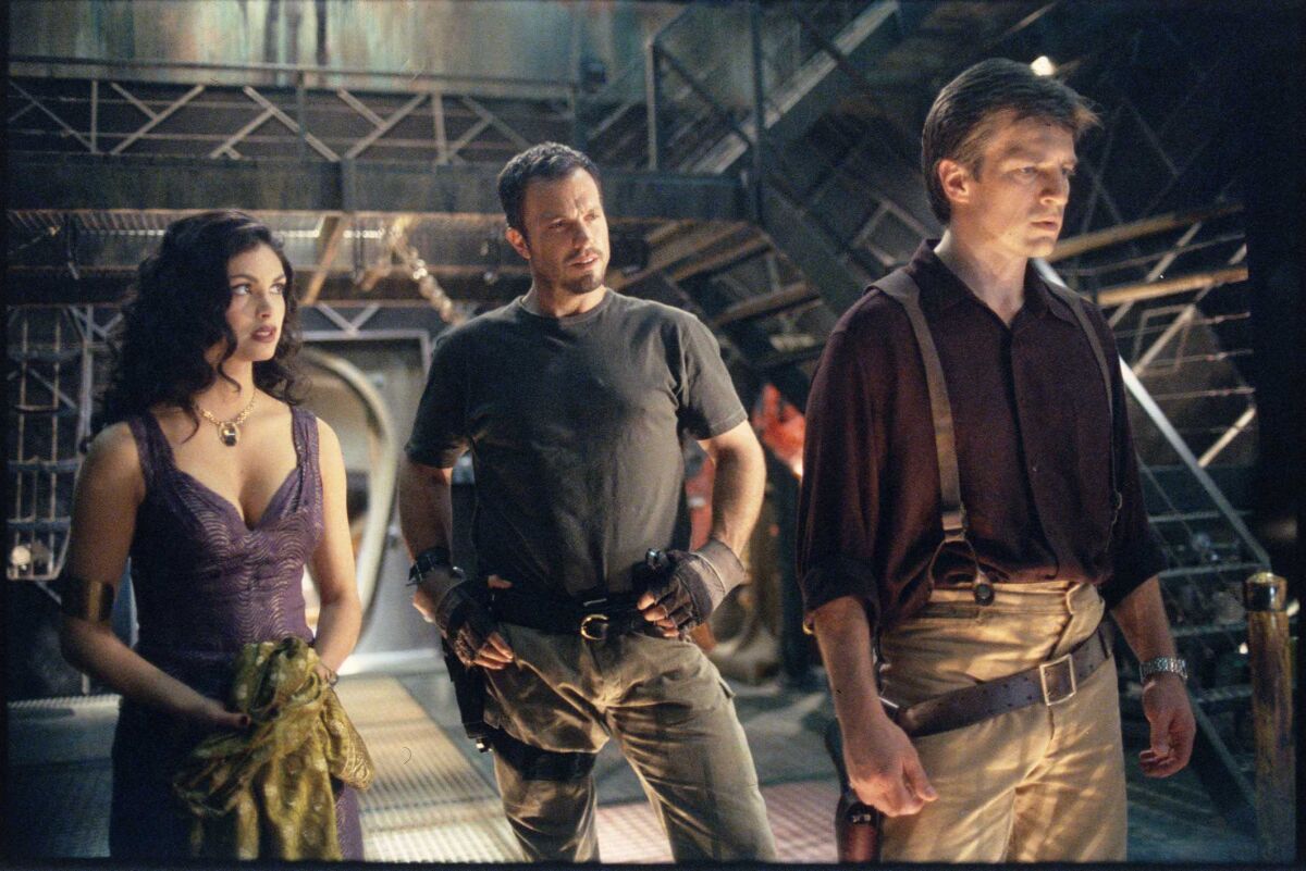 Morena Baccarin, left, Adam Baldwin and Nathan Fillion in “Firefly.”