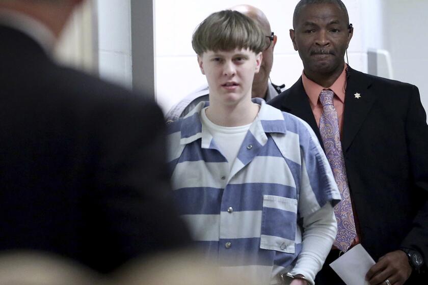 In this April 10, 2017, photo, Dylann Roof enters the courtroom at the Charleston County Judicial Center in Charleston, S.C.