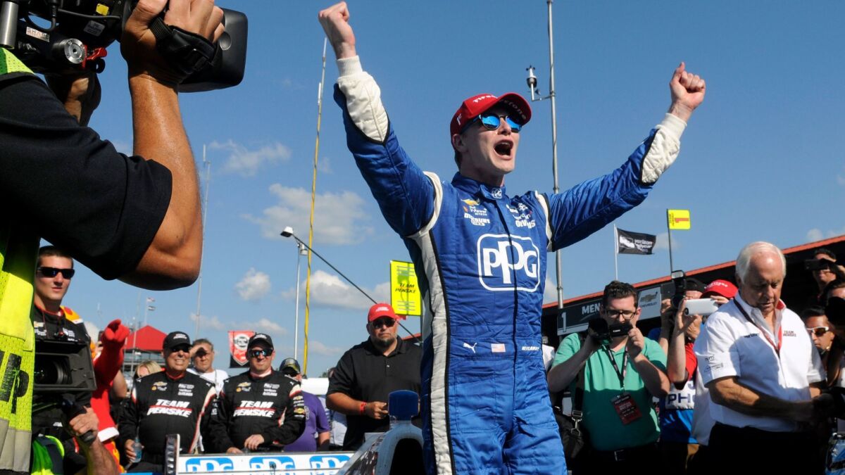 IndyCar driver Josef Newgarden celebrates after winning the Honda Indy 200 at Mid-Ohio Sports Car Course on Sunday.