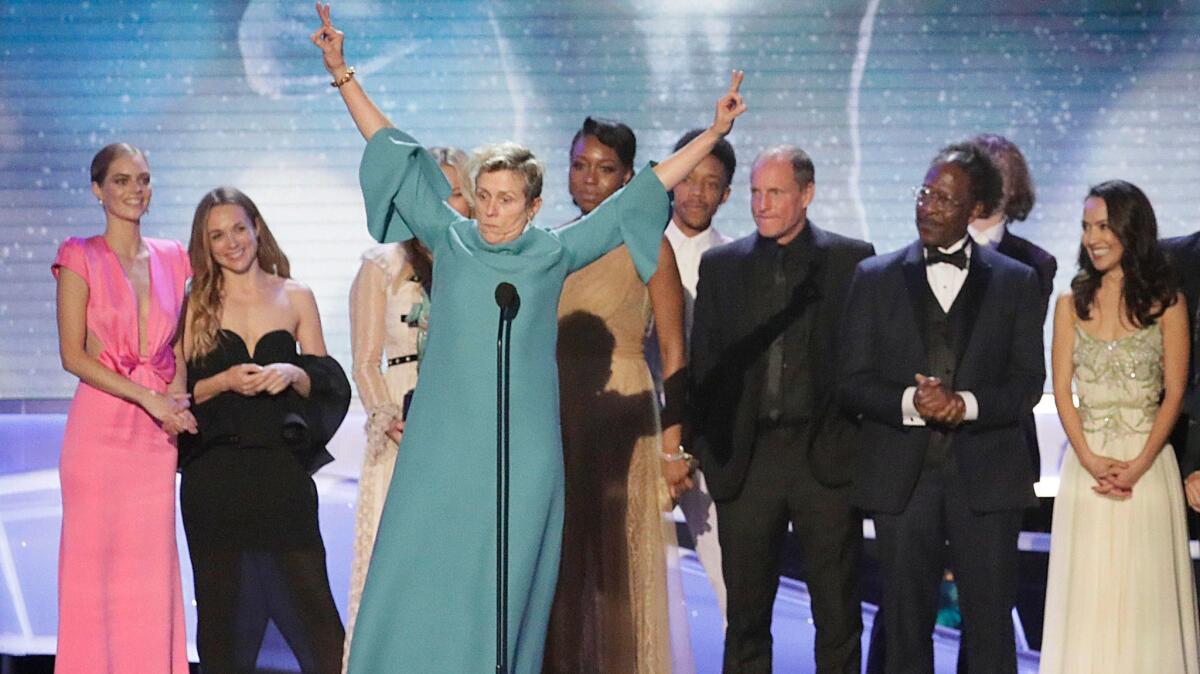 Frances McDormand celebrates the film ensemble award for "Three Billboards Outside Ebbing, Missouri" with her cast mates. She also won for lead actress.