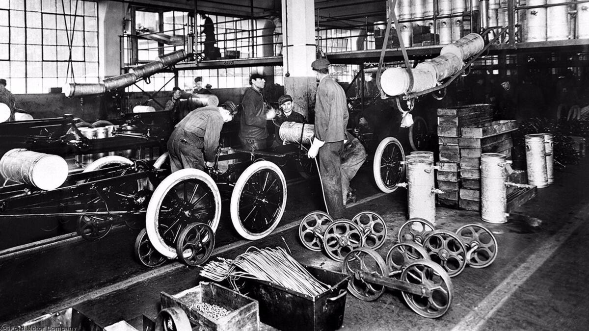 It was simpler in the old days: Laborers work on a Ford assembly line in the 1920s.