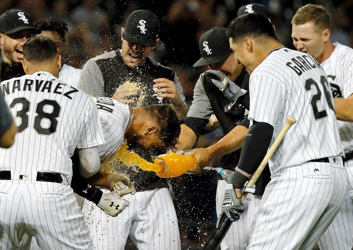 Yoan Moncada gets mobbed by teammates after hitting a walkoff RBI single against the Astros at Guaranteed Rate Field on Aug. 10, 2017.