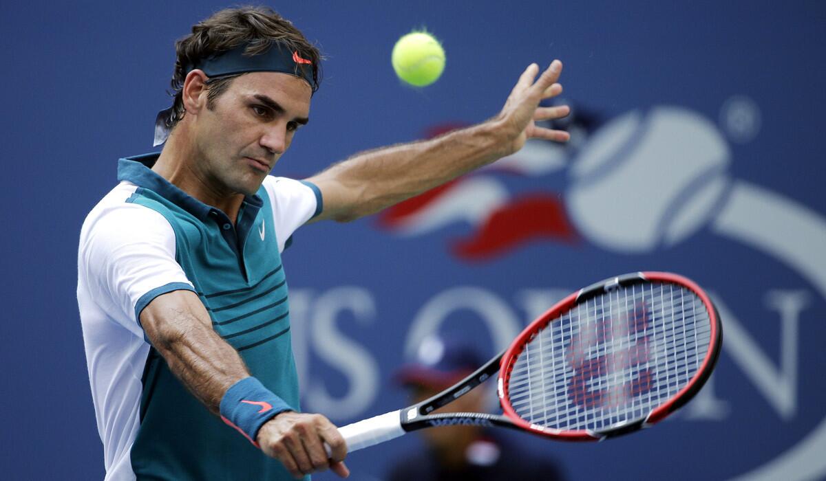 Roger Federer returns to Leonardo Mayer during the first round of the U.S. Open tennis tournament on Tuesday.