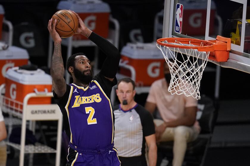 Los Angeles Lakers center Andre Drummond (2) dunks against the Sacramento Kings during the second half of an NBA basketball game Friday, April 30, 2021, in Los Angeles. (AP Photo/Marcio Jose Sanchez)