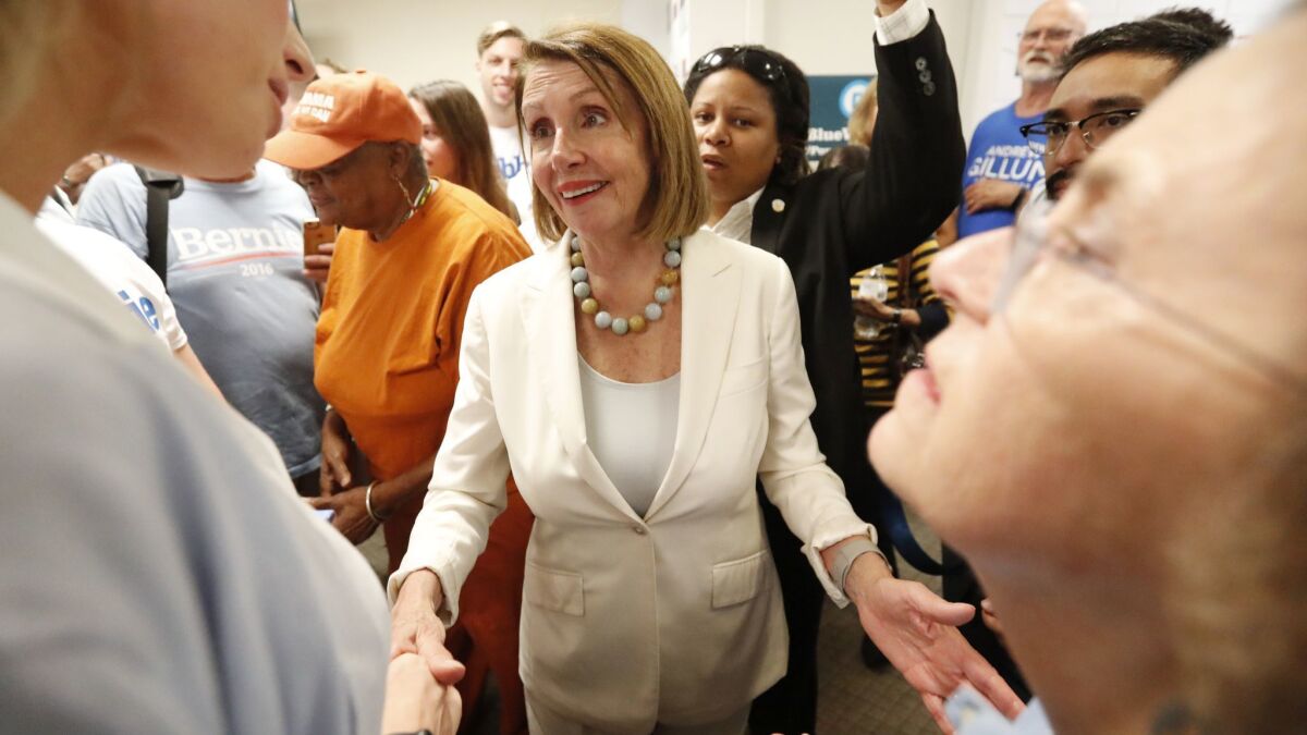 House Minority Leader Nancy Pelosi speaks to volunteers after an Oct. 17 get-out-the-vote event for Democratic candidates in Coral Gables, Fla.