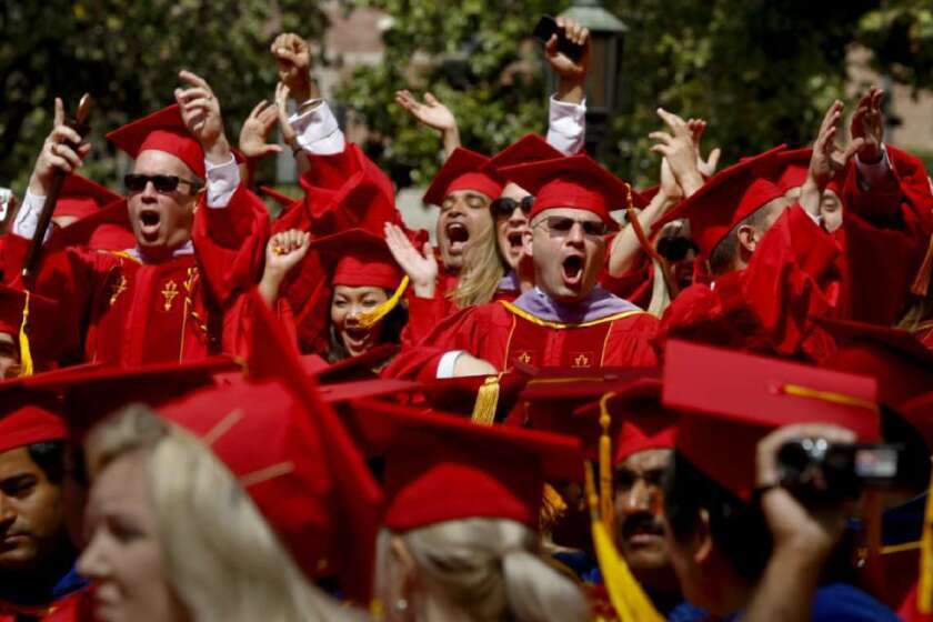 Some of the nearly 14,000 students receiving degrees are among the estimated 40,000 people filling Alumni Park at USC for the 129th annual graduation ceremony.