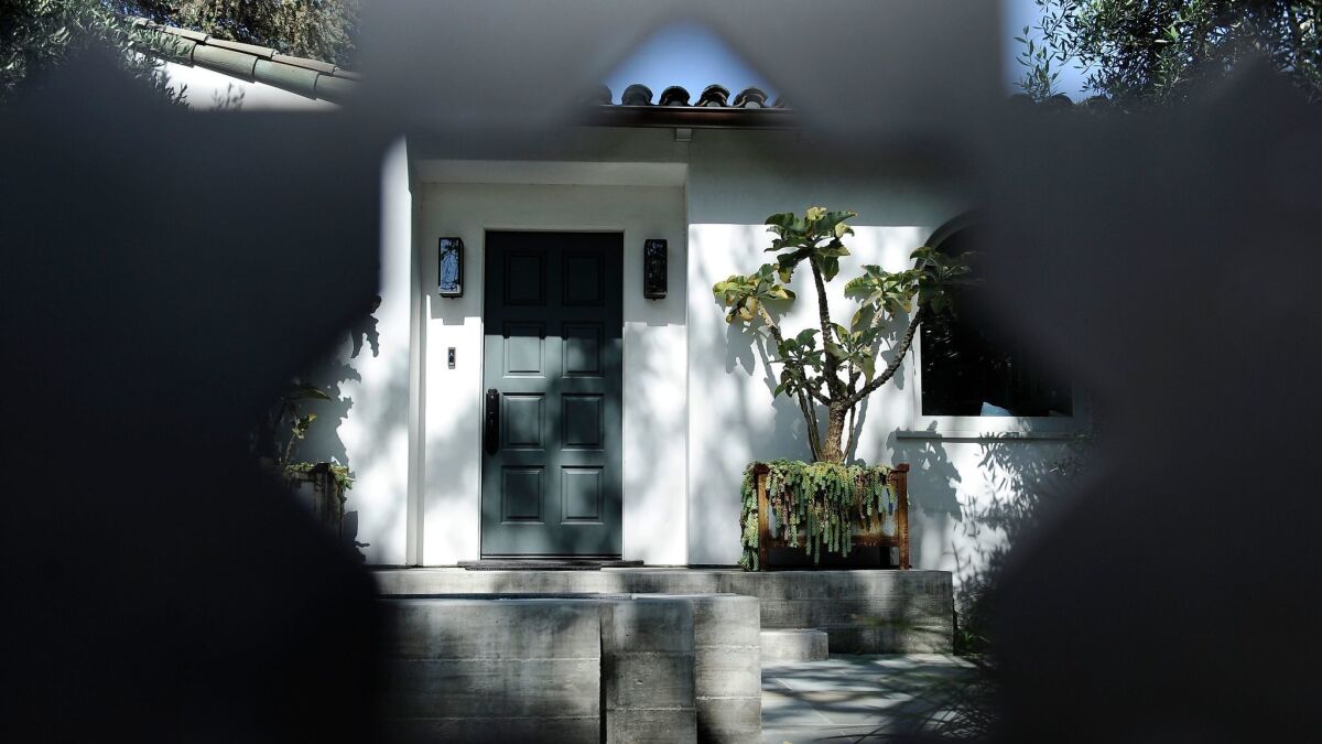 Collins refers to his Spanish bungalow as the "50 shades of gray house."