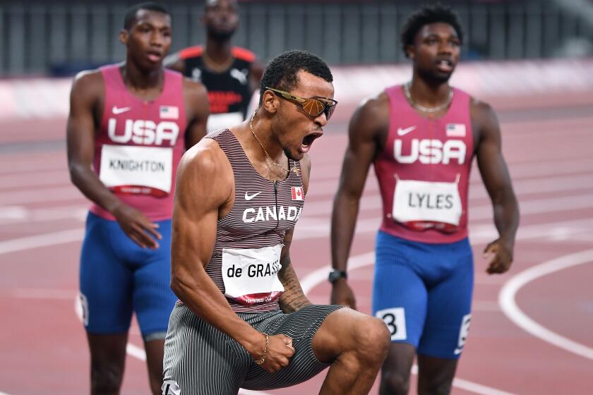 -TOKYO,JAPAN August 4, 2021: Canada's Andre de Grasse celebrates the gold medal in the 200m final at the 2020 Tokyo Olympics. (Wally Skalij /Los Angeles Times)