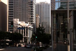 LOS ANGELES, CA - SEPTEMBER 26, 2024 OneWilshire high rise, center, used by data centers, is nestled between other buildings in downtown Los Angeles on September 26, 2024. (Genaro Molina / Los Angeles Times)