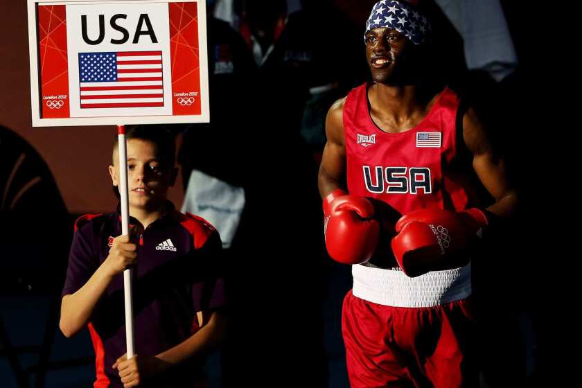 U.S. boxer Jamel Herring enters the ring prior to his men's light-welterweight bout with Daniyar Yeleussinov of Kazakhstan at the London Olympics.